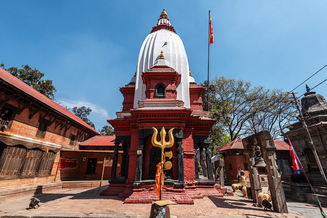 Mrigasthali Temple with Shiva trident and a blue sky, Pashupatinath, Kathmandu, Nepal, Asia