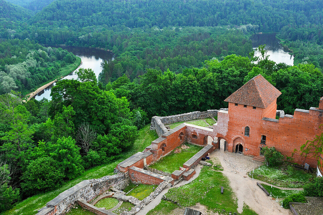 Medieval brick castle overhanging the Gauja River, Turaida Museum Reserve, Sigulda,Gauja National Park, Vidzeme Region, Latvia, Baltic region, Europe