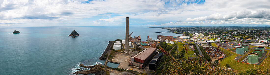 Panorama of the skyline of New Plymouth, viewed from Paritutu Rock showing the industrial port area, New Plymouth, North Island, New Zealand, Pacific