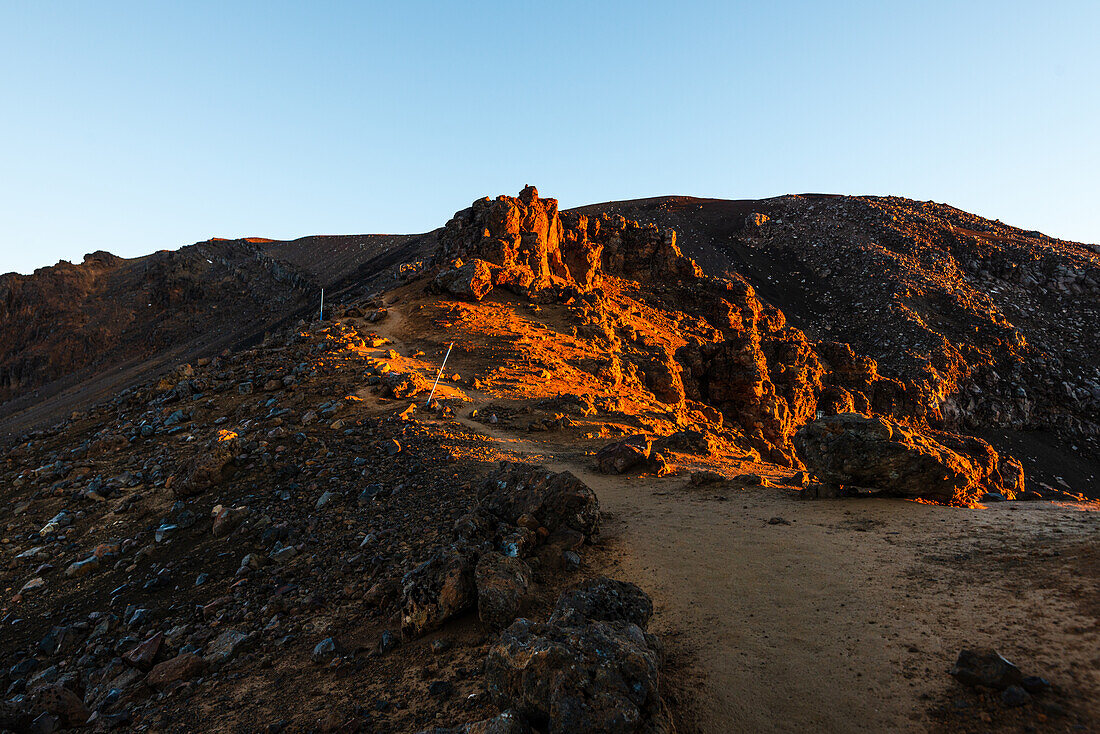 Rocky volcanic landscape on the Tongariro alpine Crossing,lit by the sunrise, North Island, New Zealand, Pacific