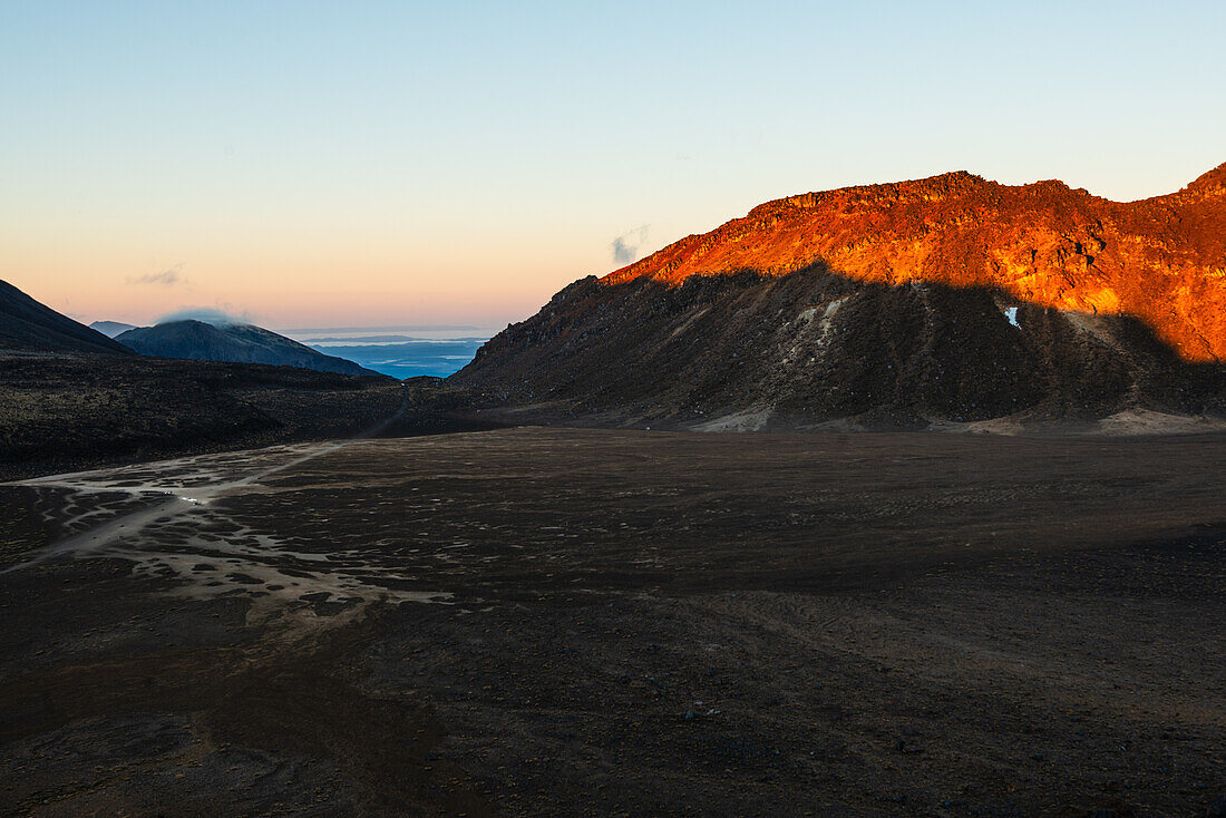 Red sunrise on Mount Tongariro with volcanic plain in front, Tongariro National Park, UNESCO World Heritage Site, North Island, New Zealand, Pacific