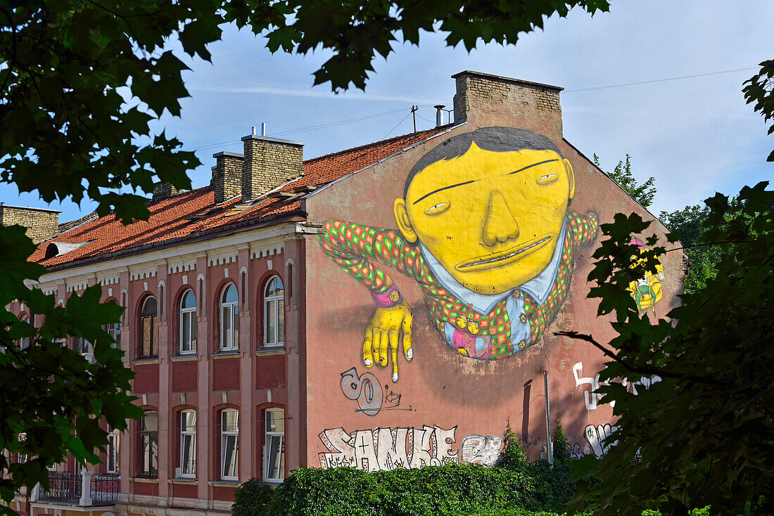 Mural painting by Os Gemeos, two Brazilian twin brothers, graffiti and street artists, Pylimo Street 60, Vilnius, Lithuania, Europe