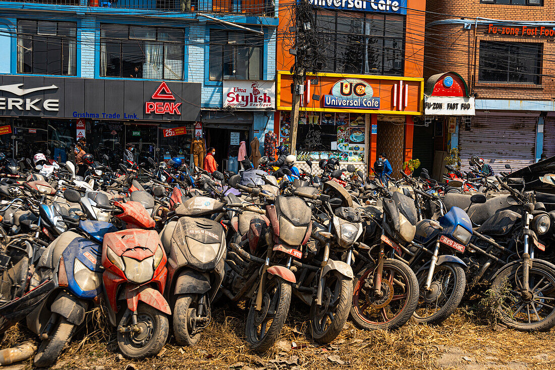 Bunch of motor bikes covered in dust in front of building, Kathmandu, Nepal, Asia