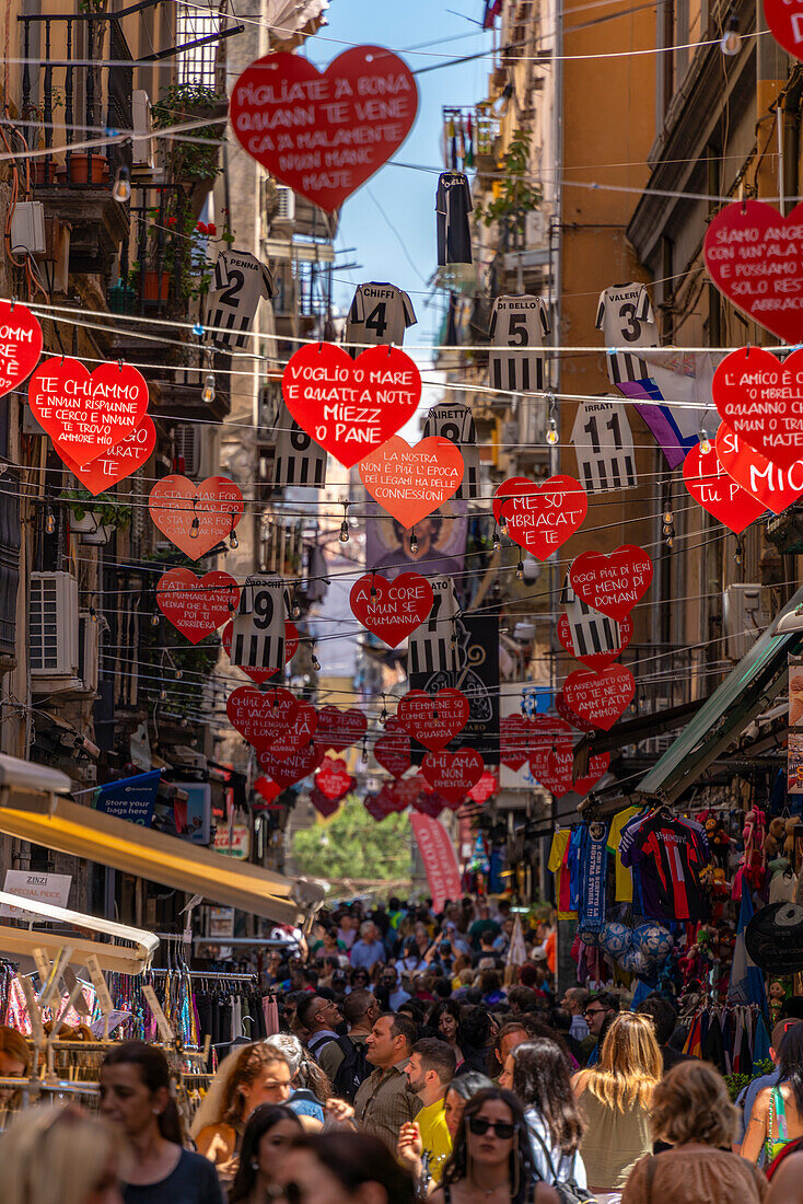 View of shops and decor on bustling Via San Biagio Dei Librai, Naples, Campania, Italy, Europe