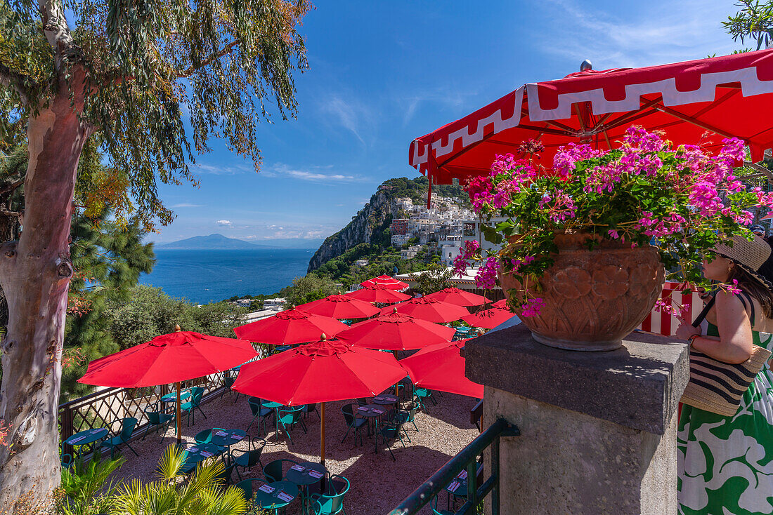 View of restaurant in Capri Town with Mount Vesuvius in background, Isle of Capri, Bay of Naples, Campania, Italy, Mediterranean, Europe