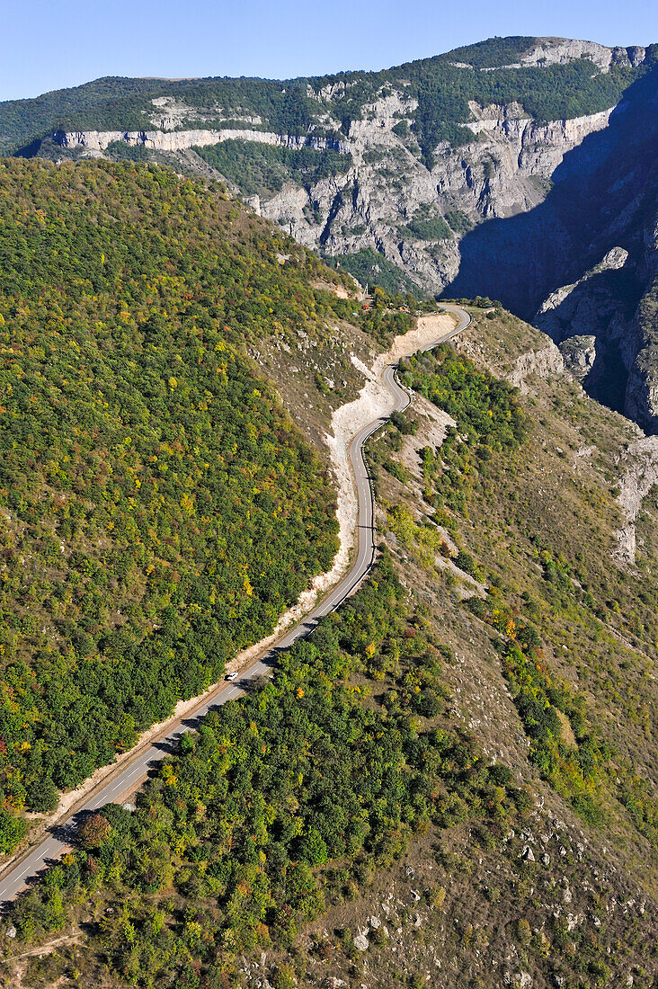 Road overhanging the deep gorge of the Vorotan River viewed from the cable car connecting the village of Halidzor, Syunik Province in southeastern Armenia, Eurasia