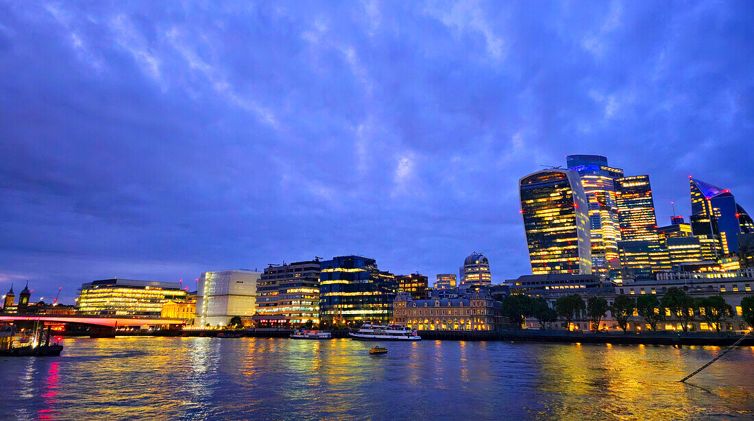 London skyline at dusk from Hays Galleria near London Bridge, London, England, United Kingdom, Europe