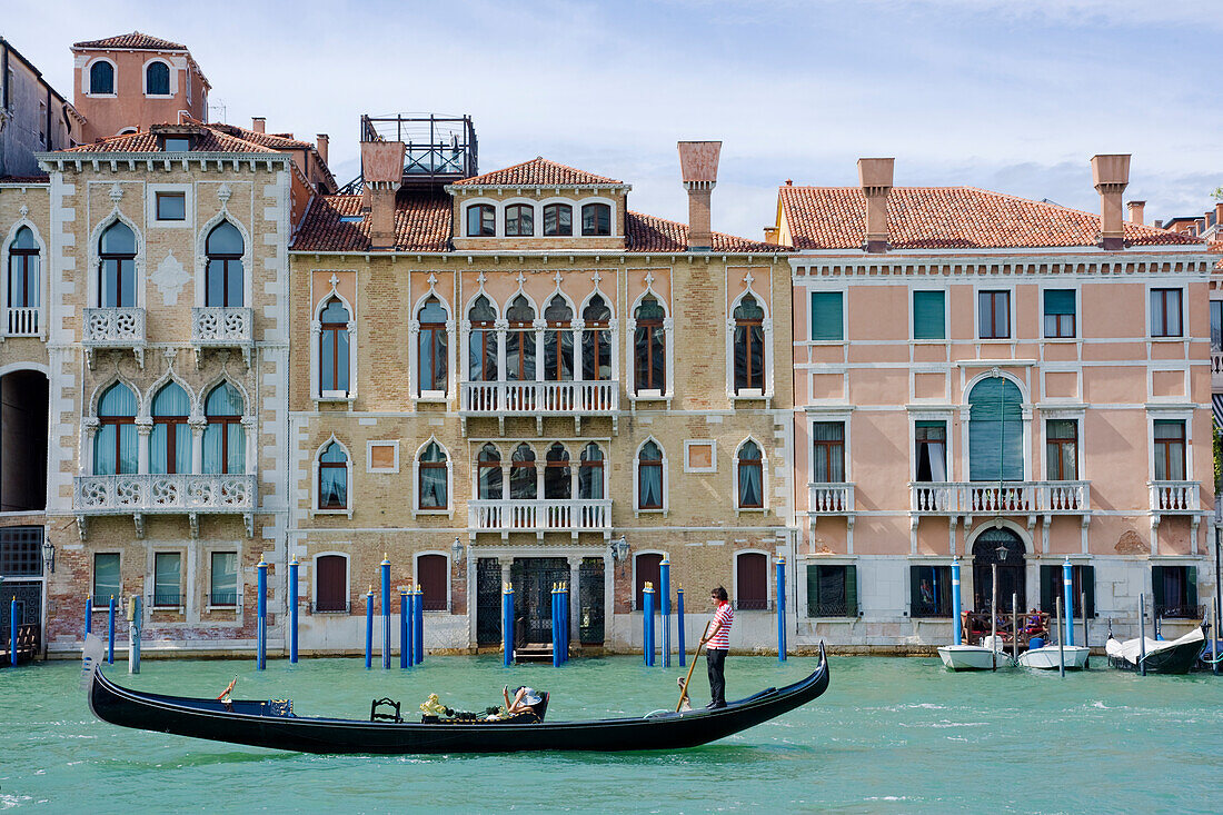 A gondola entering the Grand Canal seen from the Basilica of Santa Maria della Salute, Venice, UNESCO World Heritage Site, Veneto, Italy, Europe