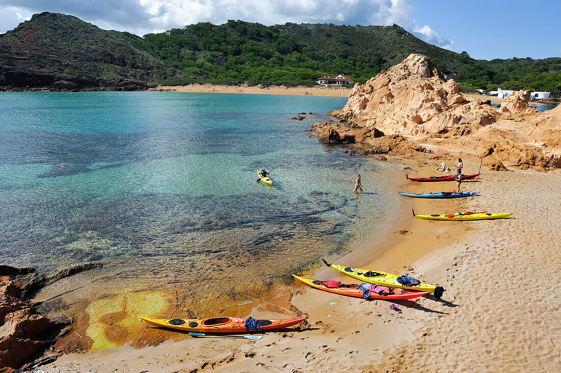 Kayaks landing on an islet in the inlet Cala Pregonda near Cape Cavalleria on the North Coast of Menorca, Balearic Islands, Spain, Mediterranean, Europe