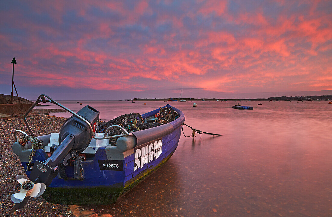 A dusk view of beached boats at low tide, in the estuary of the River Exe, at Exmouth, east Devon, England, United Kingdom, Europe