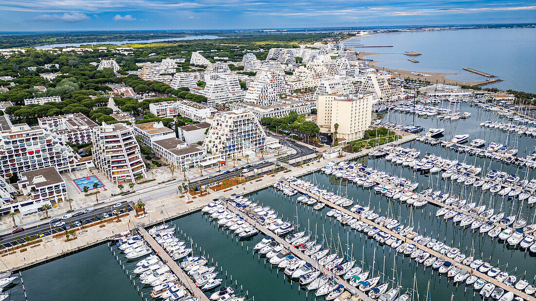 Aerial of the sport harbour, futuristic seaside town of La Grande Motte, Herault, Occitania, France, Europe