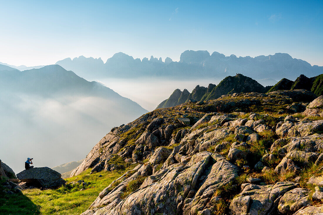 Photographer in Brenta Dolomites in summer season, Trentino Alto Adige, Italy, Europe