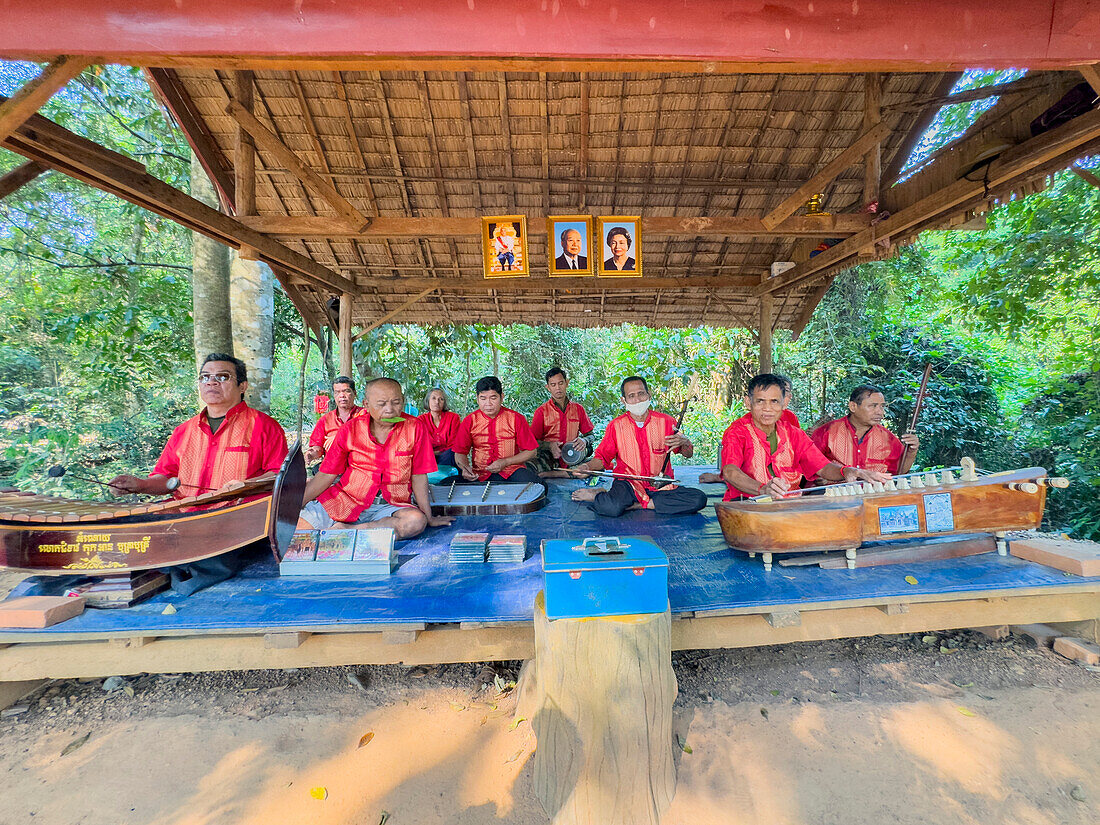 Survivors of the Khmer Rouge play together at Banteay Srei Temple in the area of Angkor, Cambodia, Indochina, Southeast Asia, Asia