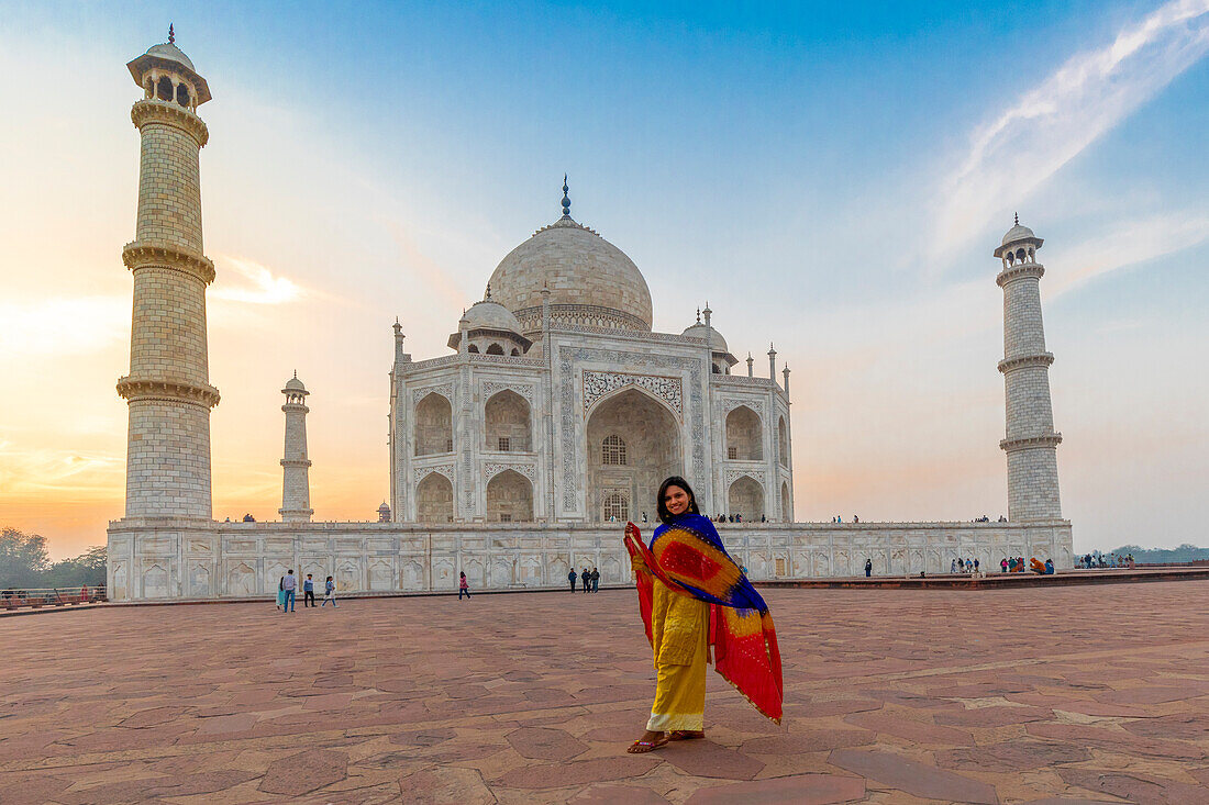 Young Indian woman in front of the Taj Mahal, UNESCO World Heritage Site, Agra, Uttar Pradesh, India, South Asia, Asia