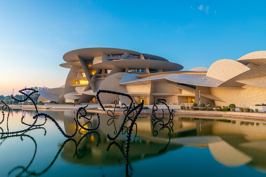 National Museum of Qatar at dusk, Doha, Qatar, Middle East,