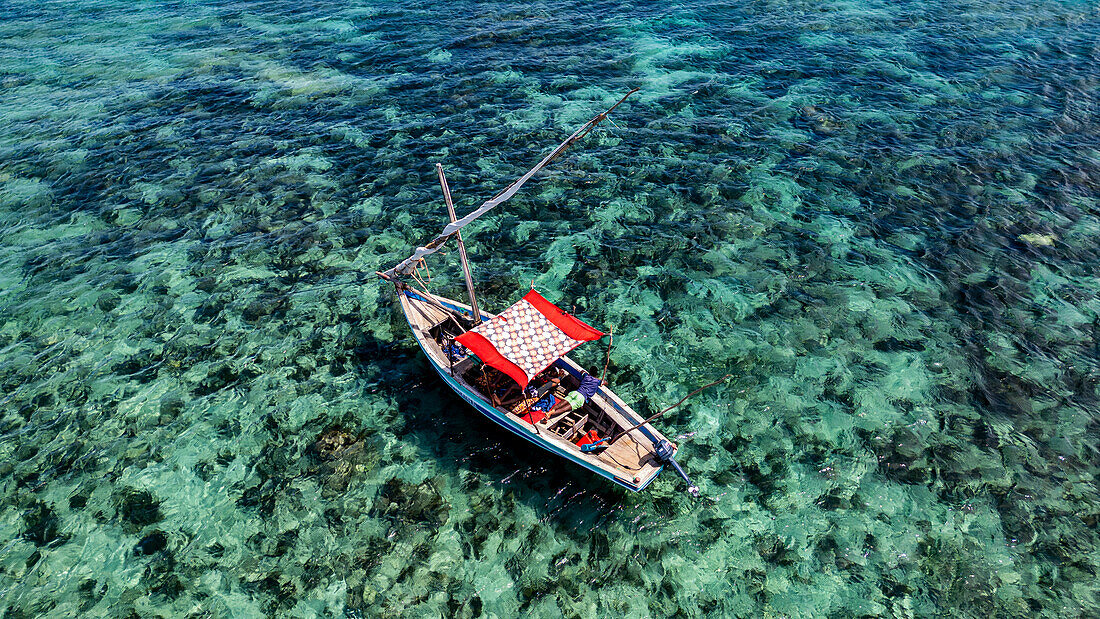 Aerial of a traditional Dhow on a white sand beach, Goa island near the Island of Mozambique, Mozambique, Africa