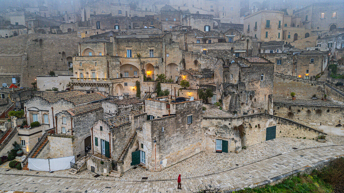 Aerial of Sassi di Matera in fog, UNESCO World Heritage Site, Basilicata, Italy, Europe