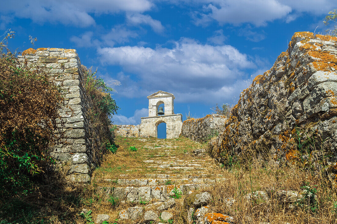 Bell tower against sky with clouds on top of a church at Agia Mavra Fort, Lefkada, Ionian Island, Greek Islands, Greece, Europe