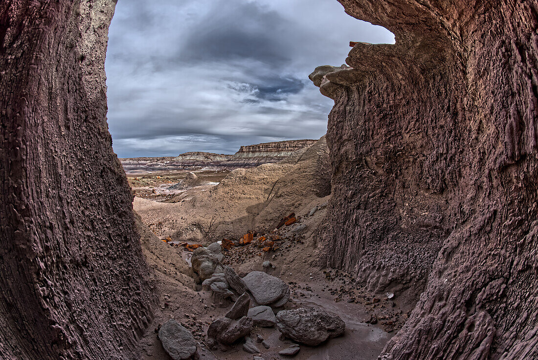 A shallow cave carved out of a cliff wall below the Blue Mesa in Petrified Forest National Park, Arizona, United States of America, North America