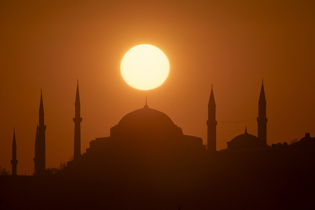 Sun aligned with the dome of Hagia Sophia Mosque, UNESCO World Heritage Site, Istanbul, Turkey, Europe