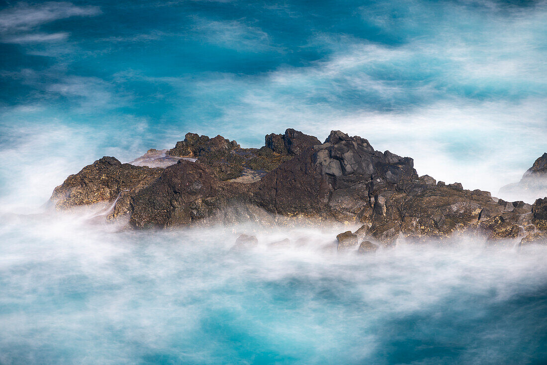 Aerial view of small rock island amongst waves, Madeira, Portugal, Atlantic, Europe