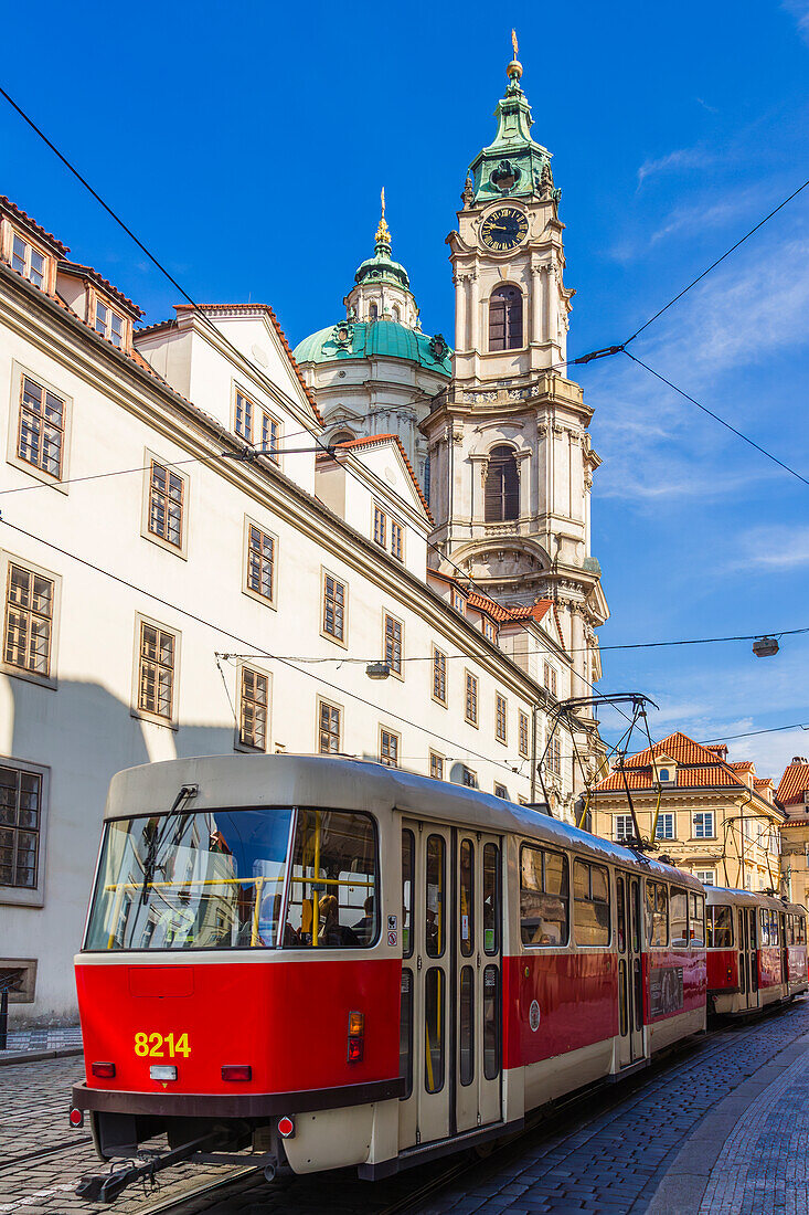 Tram and St. Nicholas Church in Lesser Quarter, Prague, Czechia, Europe