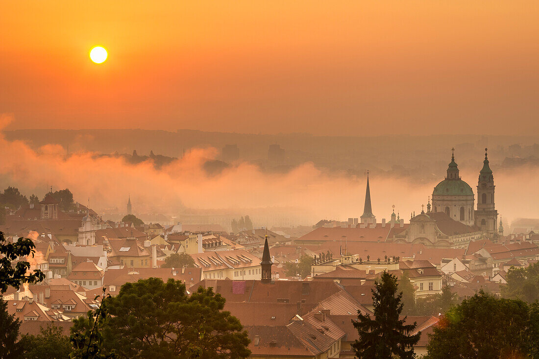 St. Nicholas Church on foggy morning at sunrise, Prague, Czech Republic (Czechia), Europe