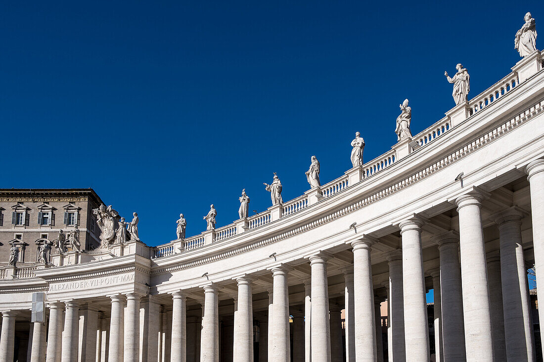 Detail of Doric colonnades in St. Peter's Square framing the entrance to St. Peter's Basilica, Vatican City, the papal enclave in Rome, UNESCO World Heritage Site, Rome, Lazio, Italy, Europe