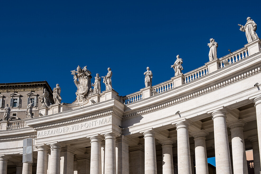 Detail of Doric colonnades in St. Peter's Square framing the entrance to St. Peter's Basilica, Vatican City, the papal enclave in Rome, UNESCO World Heritage Site, Rome, Lazio, Italy, Europe