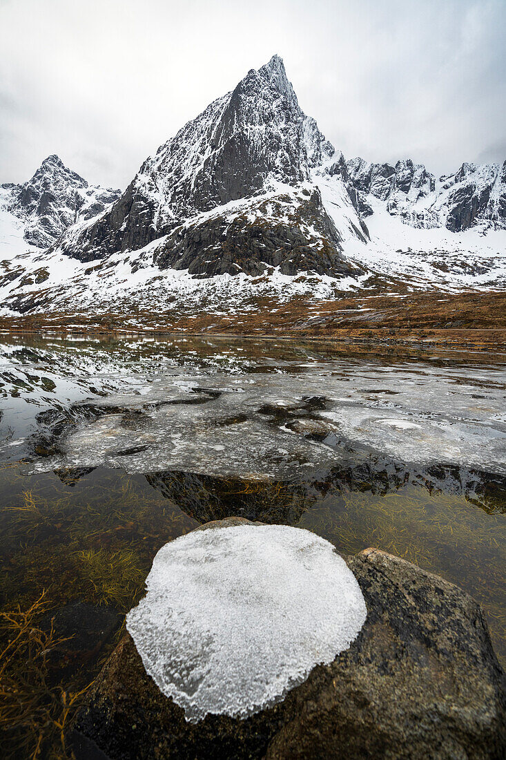 Ice formation on top of a rock in the Arctic landscape, Flakstadoya, Nordland, Lofoten Islands, Norway, Scandinavia, Europe