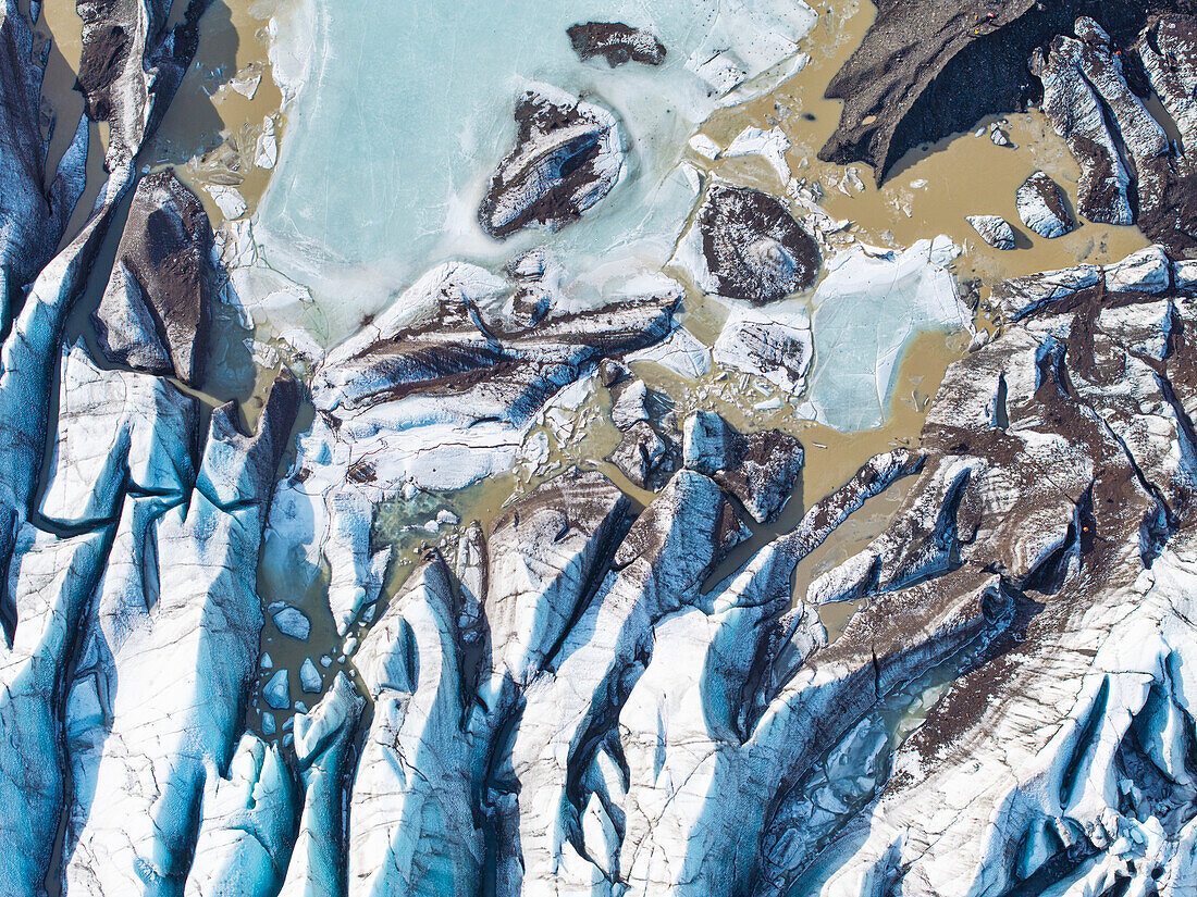 Aerial drone view of particular ice textures formed in the Svinafellsjokull glacier following global warming, Iceland, Polar Regions