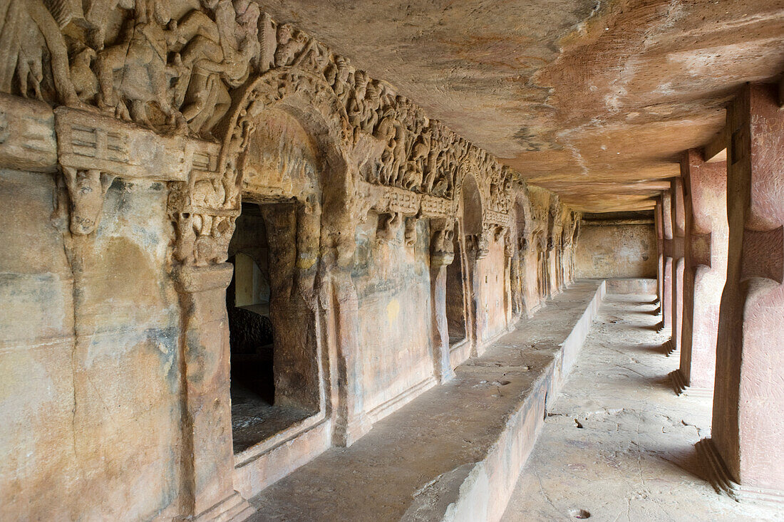 Monks' cells cut into the hillside rock among the Udayagiri and Khandagiri caves dating back to over 100 years BCE sculpted as religious retreats for Jain devotees, Bhubaneswar, Odisha, India, Asia