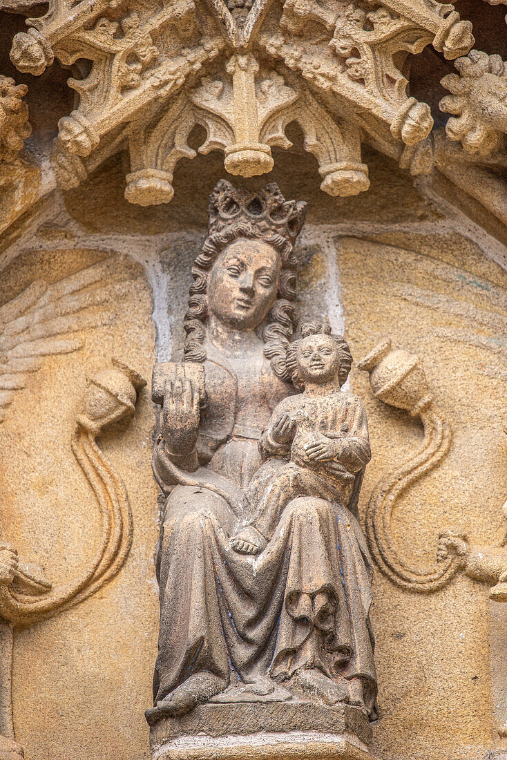 Close up of an exquisite stone sculpture of a Madonna and Child on the facade of Saint Corentin Cathedral, Quimper, Brittany, France.