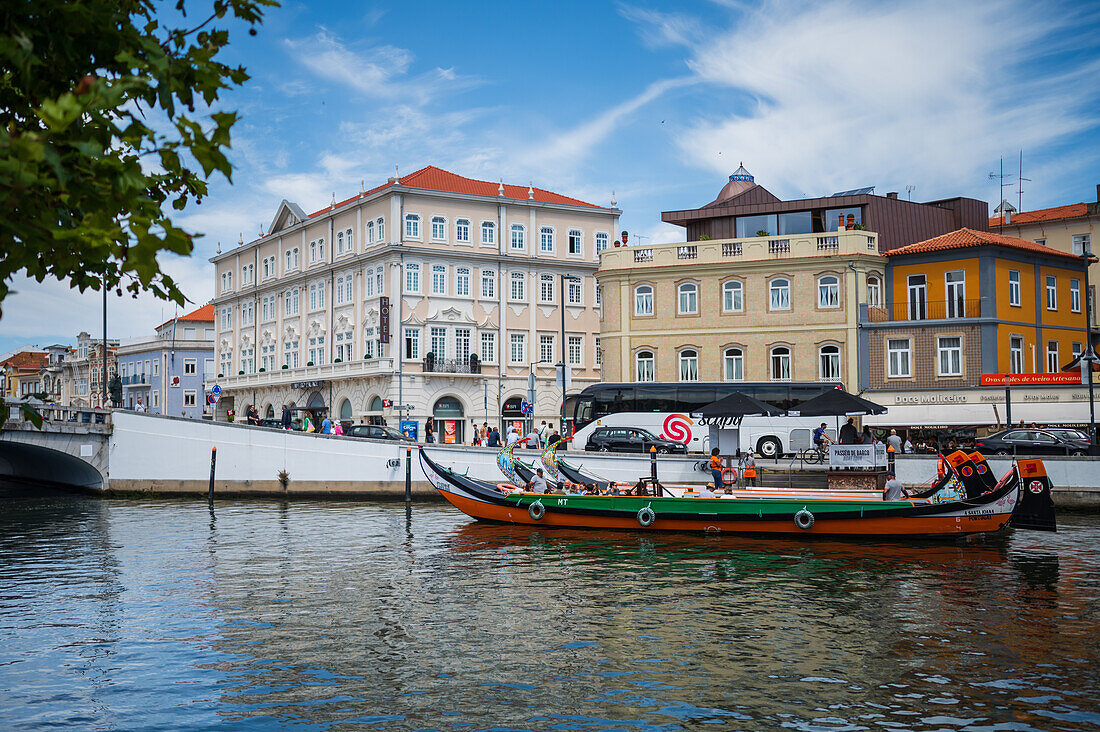 Boat ride through canals in a colorful and traditional Moliceiro boat, Aveiro, Portugal