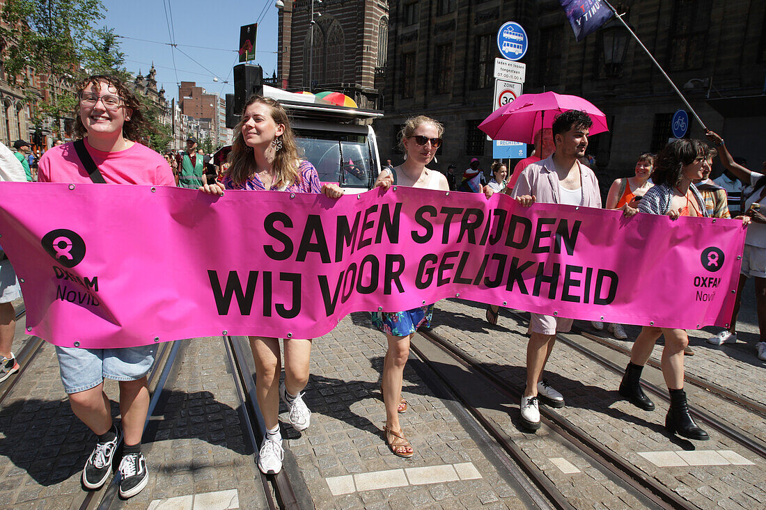 LGBTQ+ activists and supporters take part during Pride Walk protest on July 20, 2024 in Amsterdam,Netherlands. The LGBTQ+ community and supporters protest to draw attention to the fact that worldwide, lgbtq+-people are discriminated against and sometimes even arrested and prosecuted. Because of who they are.