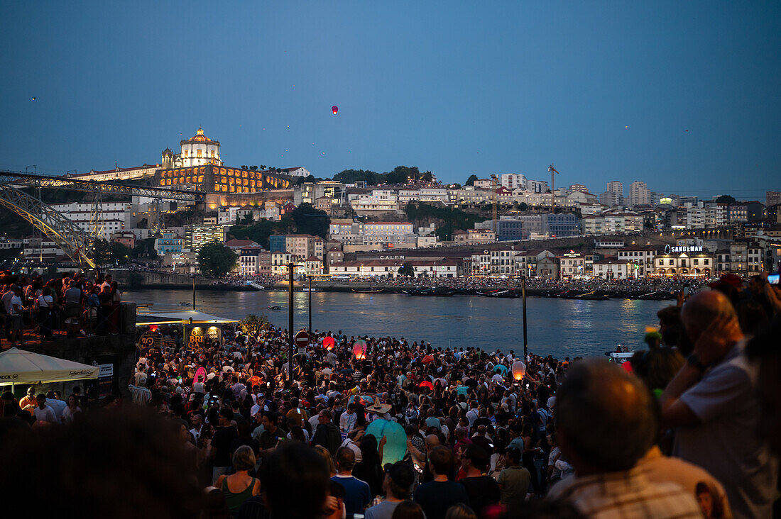 Hot air balloons launching over Luis I bridge and Douro River during Festival of St John of Porto (Festa de São João do Porto ) during Midsummer, on the night of 23 June (Saint John's Eve), in the city of Porto, Portugal