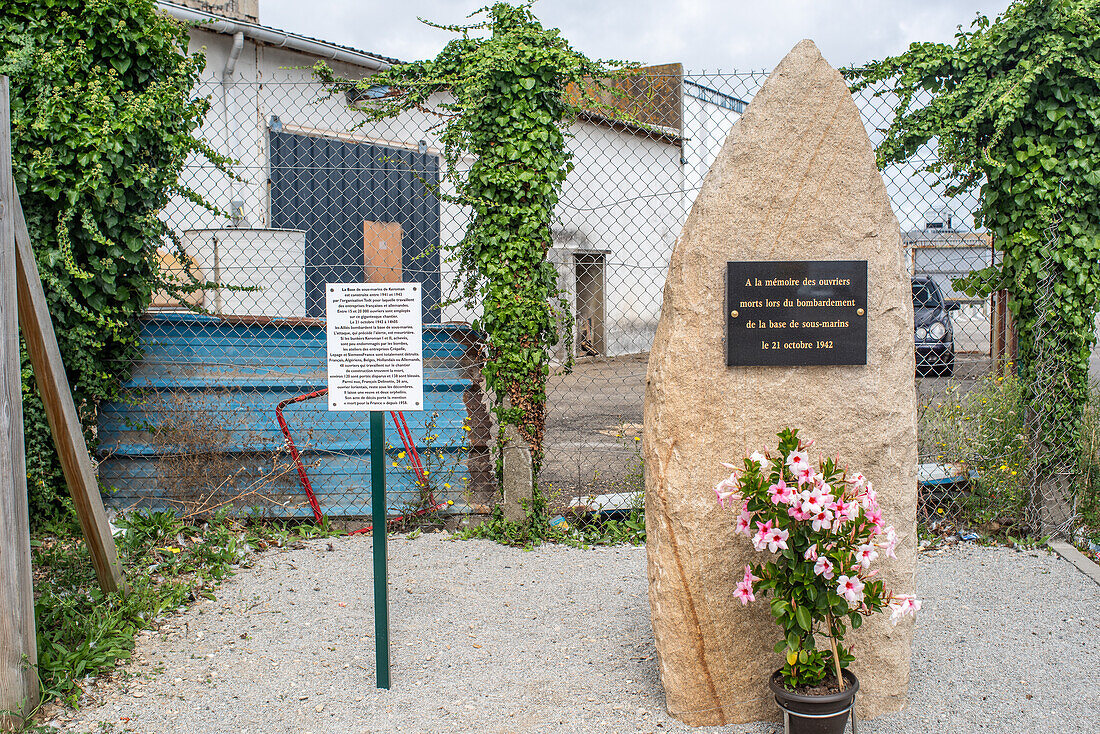 A memorial stone at the World War II German submarine base in Lorient, Brittany, France, honoring fallen workers.