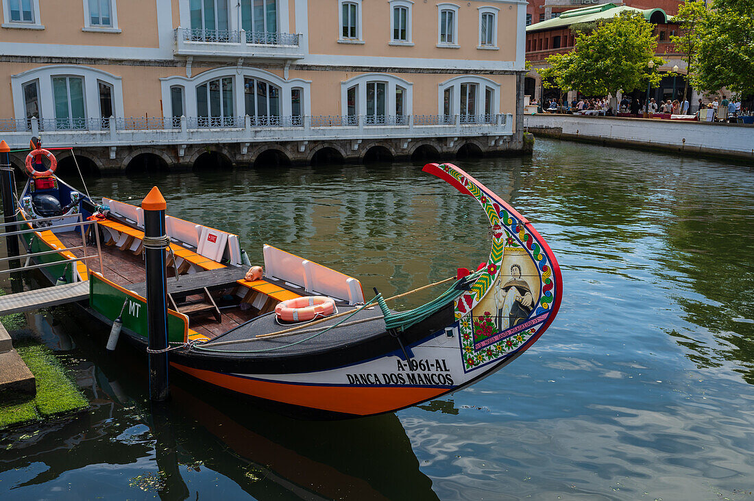 Boat ride through canals in a colorful and traditional Moliceiro boat, Aveiro, Portugal