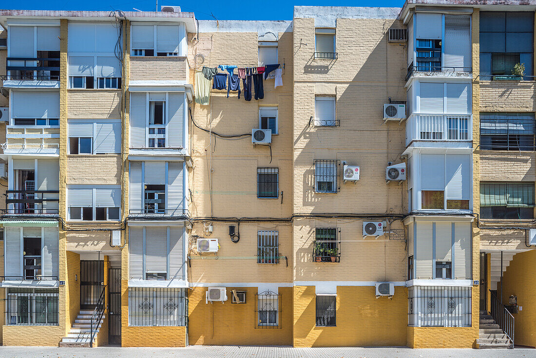 Municipal social housing from the 1960s in the La Barzola neighborhood of Seville, Andalusia, Spain. Urban residential buildings showcasing simple architectural design.