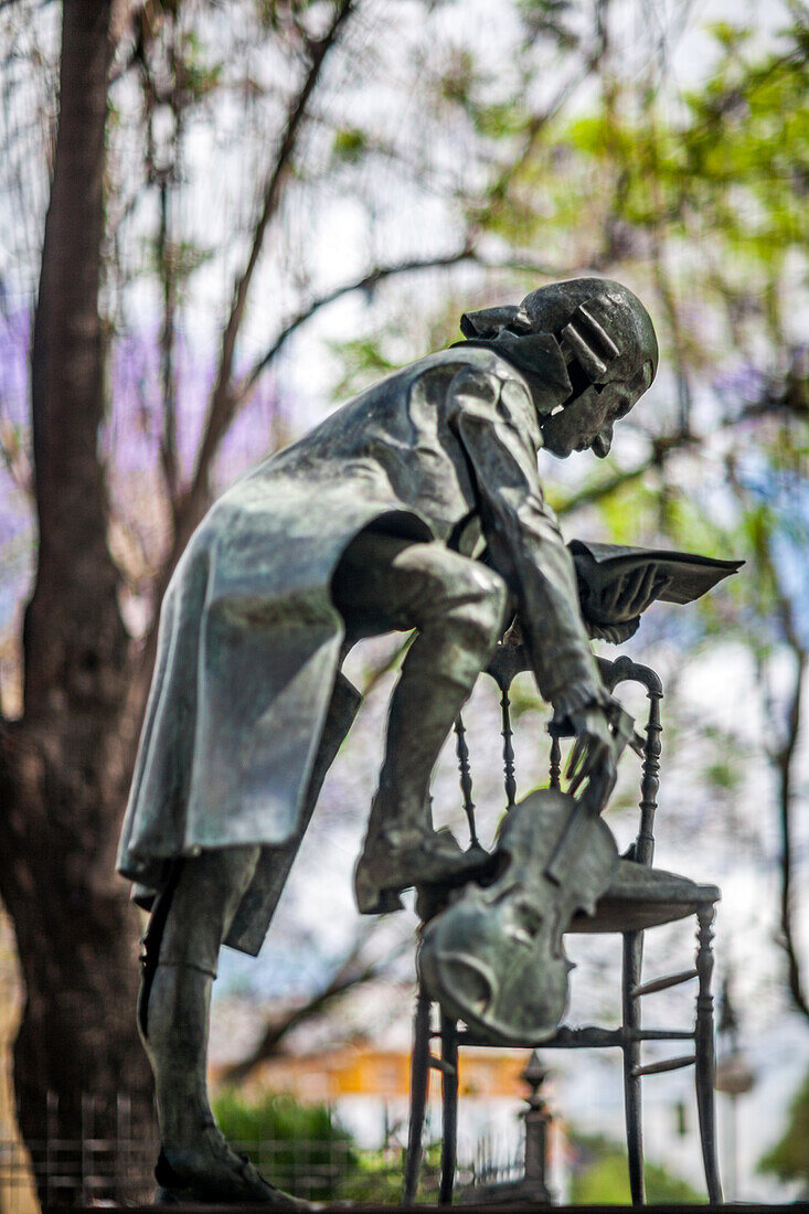 Close up of the W.A. Mozart statue situated at Maestranza Concert Hall in Seville, Spain. Captures the essence of classical music and art.