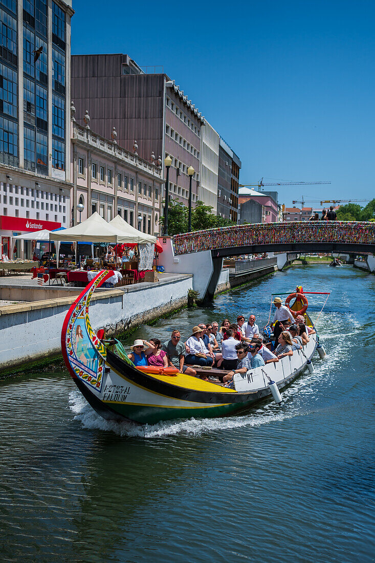 Boat ride through canals in a colorful and traditional Moliceiro boat, Aveiro, Portugal