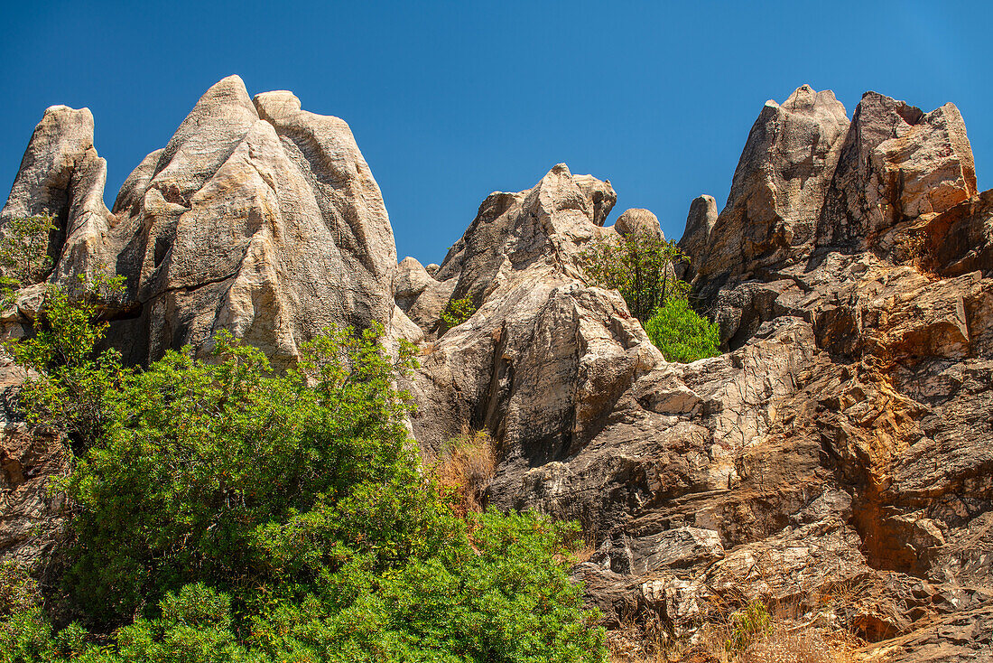 View of the unique karstic landscape at Cerro del Hierro, located in Sierra Norte de Sevilla, Spain. This natural monument showcases rugged rock formations.