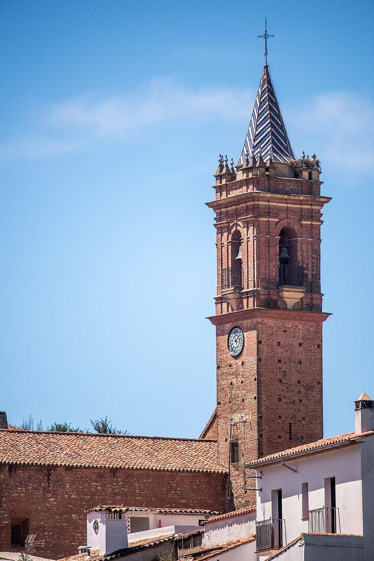 View of the Espiritu Santo church tower in Fuenteheridos, located in the picturesque province of Huelva, Andalusia, Spain.