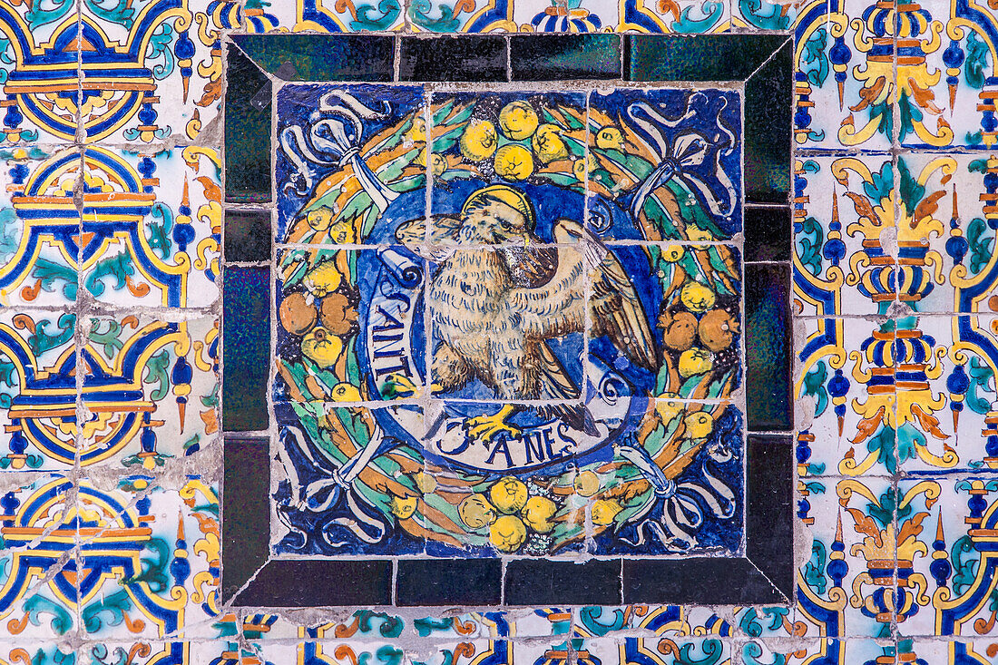 Saint John symbol on old glazed ceramic tiles, Fine Arts Museum, Seville, Spain