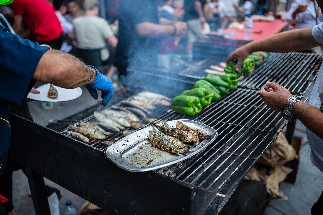 Traditional grilled sardines during Festival of St John of Porto (Festa de São João do Porto ) during Midsummer, on the night of 23 June (Saint John's Eve), in the city of Porto, Portugal