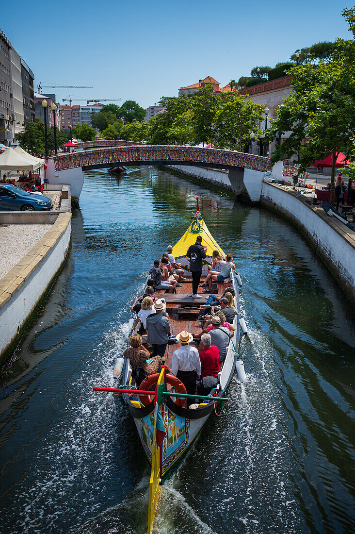 Boat ride through canals in a colorful and traditional Moliceiro boat, Aveiro, Portugal