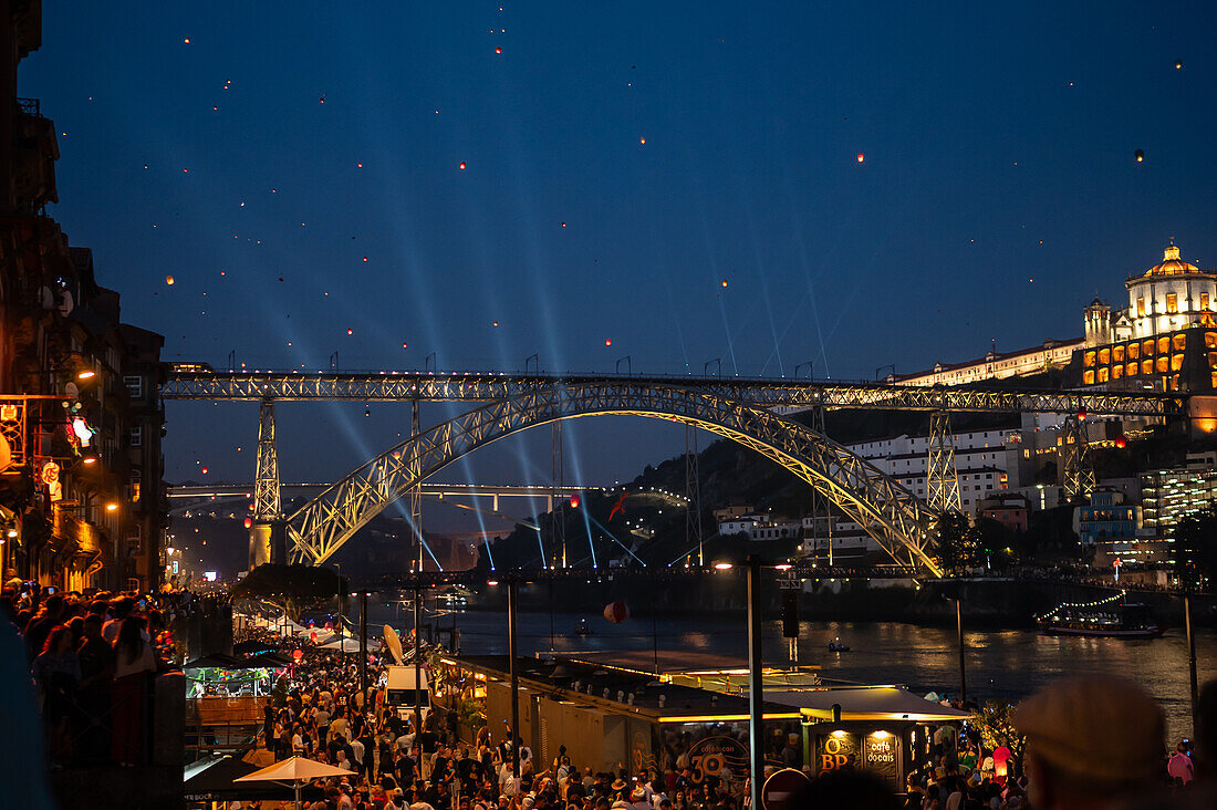 Hot air balloons launching over Luis I bridge and Douro River during Festival of St John of Porto (Festa de São João do Porto ) during Midsummer, on the night of 23 June (Saint John's Eve), in the city of Porto, Portugal