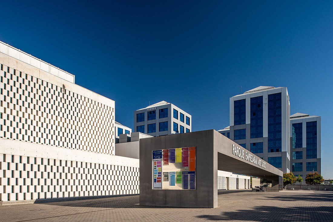 Modern business park featuring contemporary architecture in Seville, Andalucia, Spain. Parque Empresarial Arte Sacro with sleek building design under a clear blue sky.