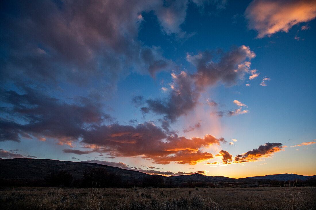 Romantic sky at sunset above landscape