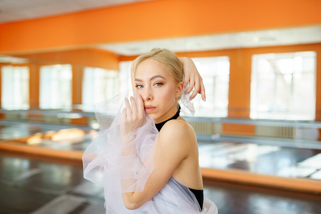 Portrait of ballerina in ballet studio